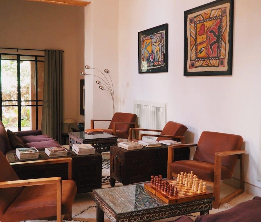 a living room filled with furniture and a chess board